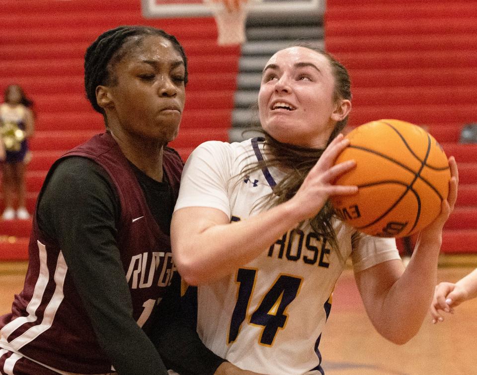 St. Rose’s Cassidy Kruesi drives in a shoots against Prep’s Mikayla Blakes. Rutgers Prep Girls Basketball vs. St. Rose in NJSIAA Non-Public Sectional finals at Jackson Liberty High School in Jackson NJ on March 4, 2024.