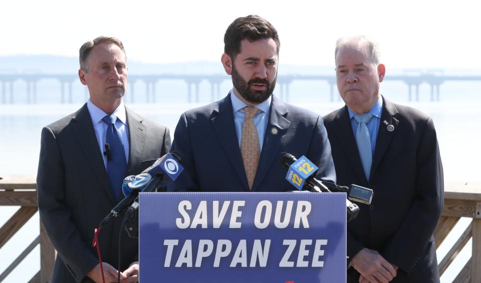 New York State Assemblyman Mike Lawler, center, with Rob Astorino and Rockland County Executive Ed Day, call for the changing of the name of the Gov. Mario M. Cuomo Bridge to its former name, the Tappan Zee Bridge, at Memorial Park in Nyack March 18, 2022.