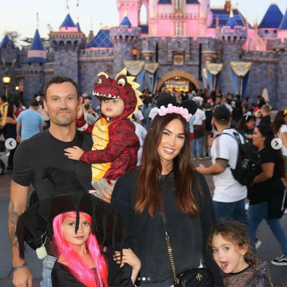 Brian Austin Green (L) and Megan Fox with their kids