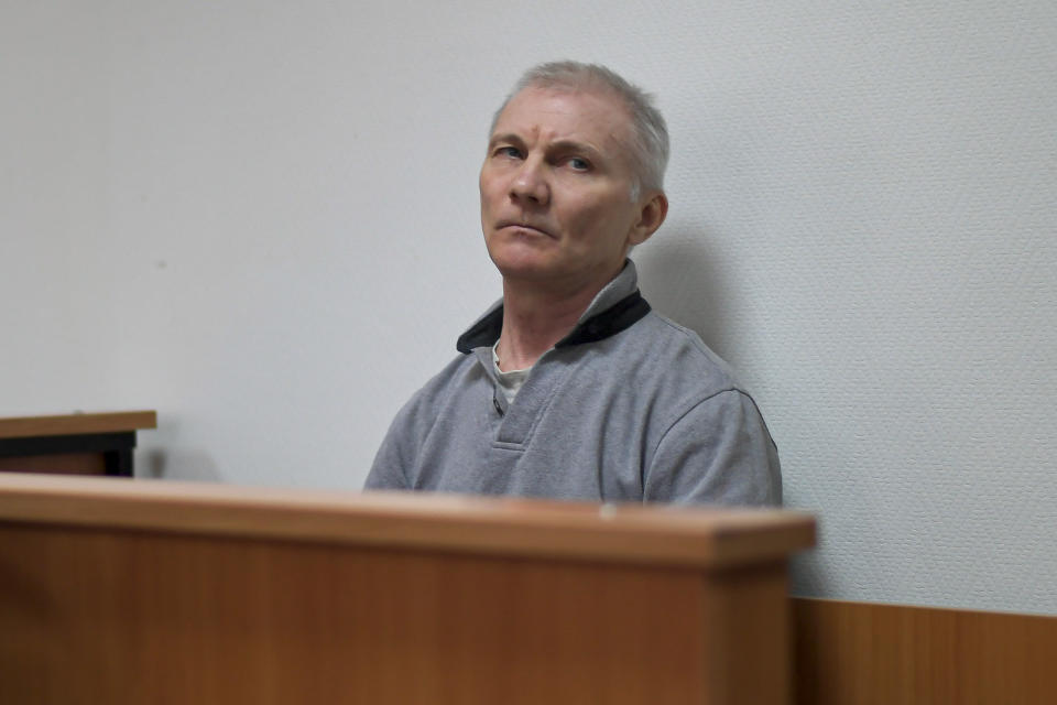 Alexei Moskalyov sits in a courtroom in Yefremov, Tula region, some 300 kilometers (186 miles) south of Moscow, Russia, Monday, March 27, 2023. A court in Russia on Tuesday convicted a single father over social media posts criticizing the war in Ukraine and sentenced him to two years in prison — a case brought to the attention of authorities by his daughter's drawings against the invasion at school, according to the man's lawyer and local activists. The 54-year-old Moskalyov, a single father of a 13-year-old daughter, was accused of repeatedly discrediting the Russian army, a criminal offense in accordance to a law Russian authorities adopted shortly after sending troops into Ukraine. (AP Photo)
