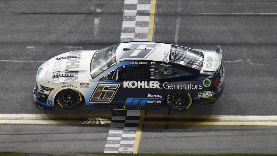 Brad Keselowski crosses the finish line to win the first of two NASCAR Daytona 500 qualifying auto races Thursday, Feb. 17, 2022, at Daytona International Speedway in Daytona Beach, Fla. (AP Photo/Chris O'Meara)