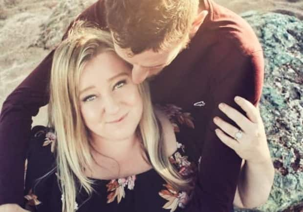 Toni Lannigan, shown in an engagement photo with her fiancé, says she is still not herself after having a serious allergic reaction to the Pfizer BioN-Tech vaccine.  (Tracy Stewart - image credit)