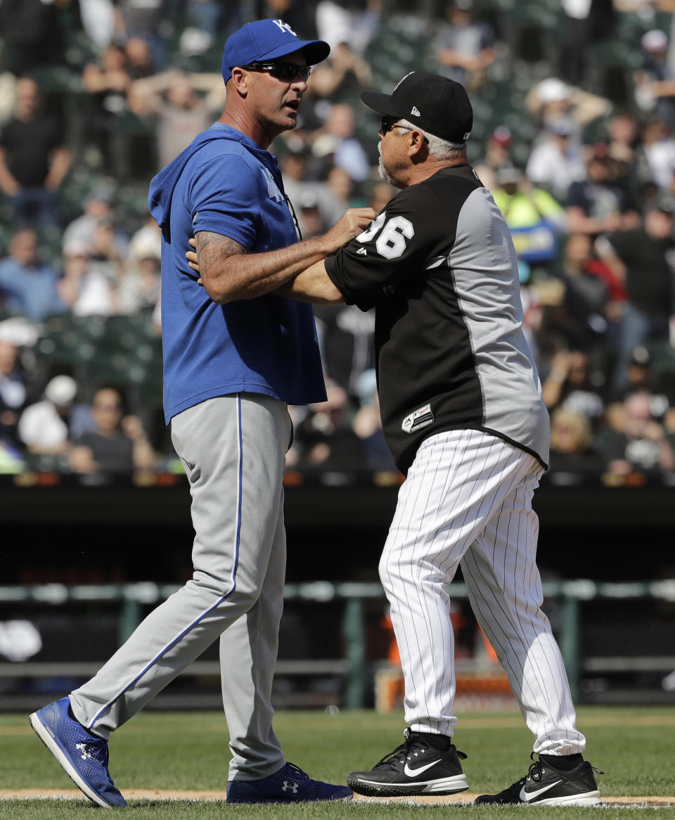 Kansas City Royals bench coach Dale Sveum, left, and Chicago White Sox manager Rick Renteria shove each other as benches clear after Chicago White Sox's Tim Anderson was hit by a pitch during the sixth inning of a baseball game in Chicago, Wednesday, April 17, 2019. The Royals won 4-3. (AP Photo/Nam Y. Huh)