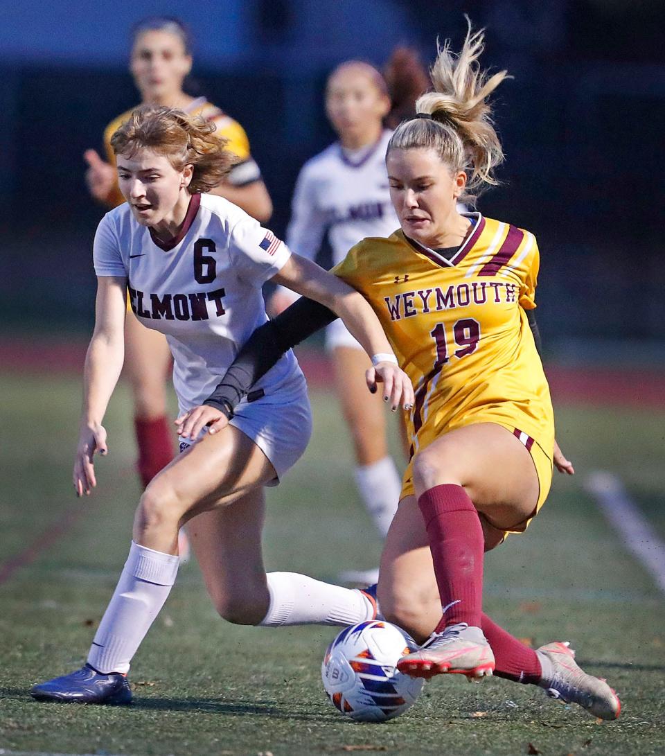 Weymouth's Ella Scalisi and Belmont's Lena Marinell battle for ball control along the sideline in Weymouth during the MIAA girls soccer tournament Nov. 6.