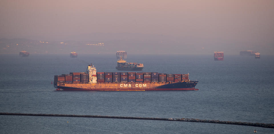 Los Angeles, CA - October 13 The sunset illuminates the scene of dozens of container ships siting off the coast of the Ports of Los Angeles and Long Beach, waiting to be unloaded Wednesday, Oct. 13, 2021. President Biden is set to announce Wednesday that the Port of Los Angeles would operate around the clock to alleviate a logistical bottleneck that has left dozens of container ships idling off the California coast and Americans waiting longer to get products manufactured overseas. The agreement to have longshoremen unloading cargo through the night is intended to speed the flow of toys, electronics and other gifts to American doorsteps during the holiday season.
(Allen J. Schaben / Los Angeles Times via Getty Images)