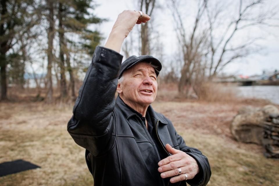 Doug George-Kanentiio stands near the bank of the St. Lawrence River in the Mohawk Nation at Akwesasne on April 6, 2023.