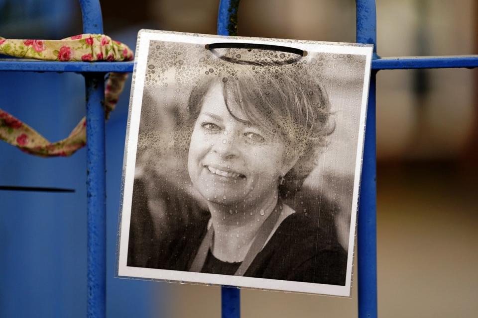 A photograph of Ruth Perry attached to the fence outside John Rankin Schools, where headteacher Flora Cooper is planning to refuse entry to Ofsted inspectors (PA)