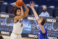 Villanova forward Jeremiah Robinson-Earl (24) shoots over Creighton center Ryan Kalkbrenner (32) during the first half of an NCAA college basketball game Wednesday, March 3, 2021, in Villanova, Pa. (AP Photo/Laurence Kesterson)