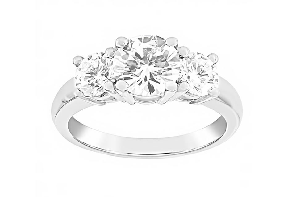 <a href="https://www.londonjewelers.com/two-by-london-three-stone-round-diamond-four-prong-ring" rel="nofollow noopener" target="_blank" data-ylk="slk:Two by London three stone round diamond four prong ring,;elm:context_link;itc:0;sec:content-canvas" class="link ">Two by London three stone round diamond four prong ring,</a> $23,050