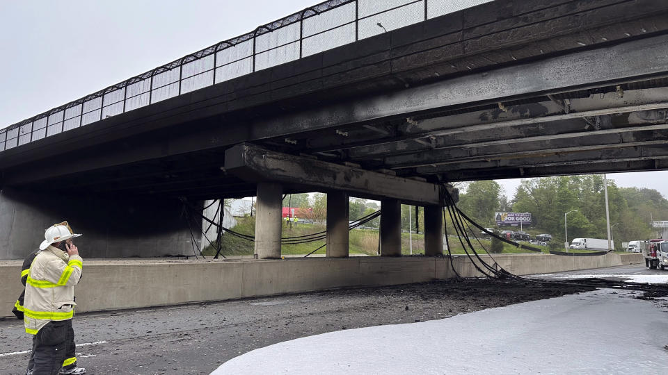 In this image provided by the Connecticut Governor's Office, emergency personnel work at the scene of a fiery early morning crash that left both sides of Interstate 95, the East Coast’s main north-south highway, shut down in southwestern Connecticut., Thursday, May 2, 2024, in Norwalk, Conn. (Norwalk Fire Department/Connecticut Governor's Office via AP)