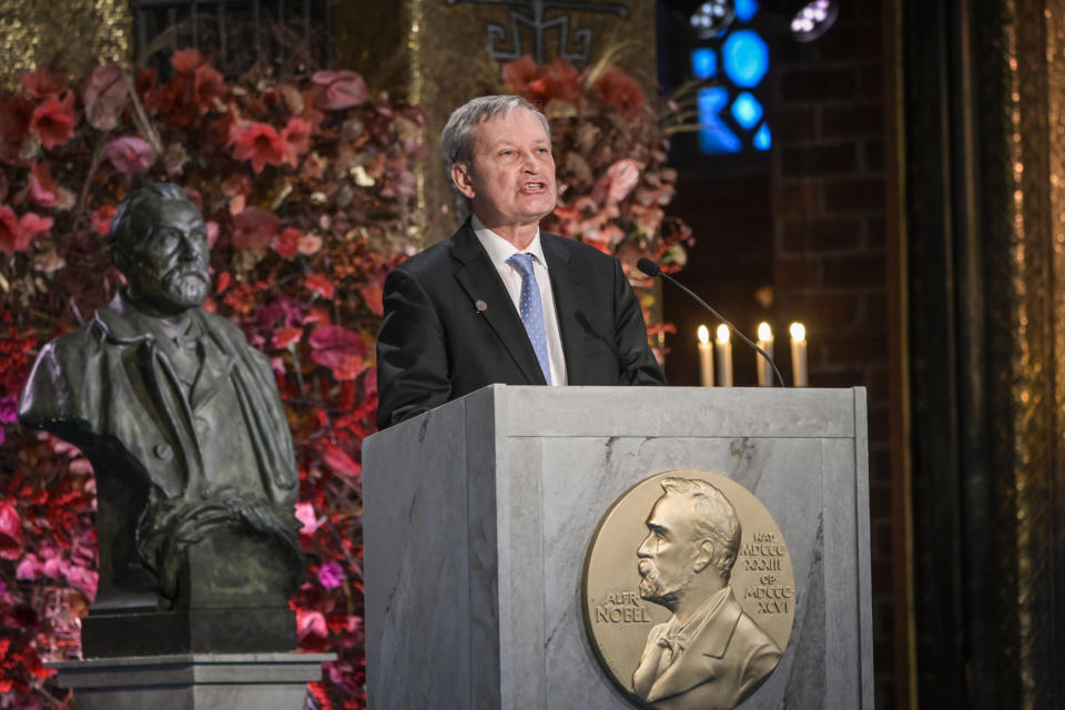 Professor Carl-Henrik Heldin, Chairman of the Board of the Nobel Foundation, gives a speech during the Nobel Prize ceremony in the Golden Hall in the City Hall of Stockholm, Sweden, on Thursday Dec. 10, 2020. Due to the coronavirus pandemic, a digital awards ceremony takes place at the Stockholm City Hall with no laureate present, and parts of the ceremony is pre-produced. (Fredrik Sandberg / TT via AP)