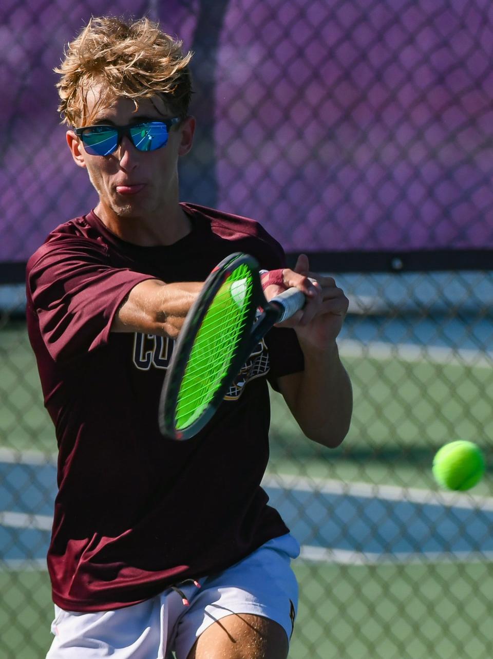 Bloomington North’s Connor O’Guinn hits a forehand during his No. 1 singles match against Bloomington South’s David Ciucu during the IHSAA Boys’ tennis sectional championship at South on Saturday, Sept. 30, 2023.