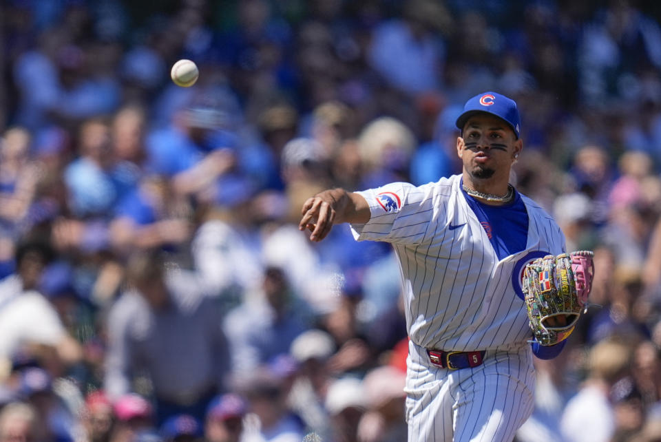 Chicago Cubs third baseman Christopher Morel throws to first to force out San Diego Padres' Fernando Tatis Jr. during the third inning of a baseball game Wednesday, May 8, 2024, in Chicago. (AP Photo/Erin Hooley)