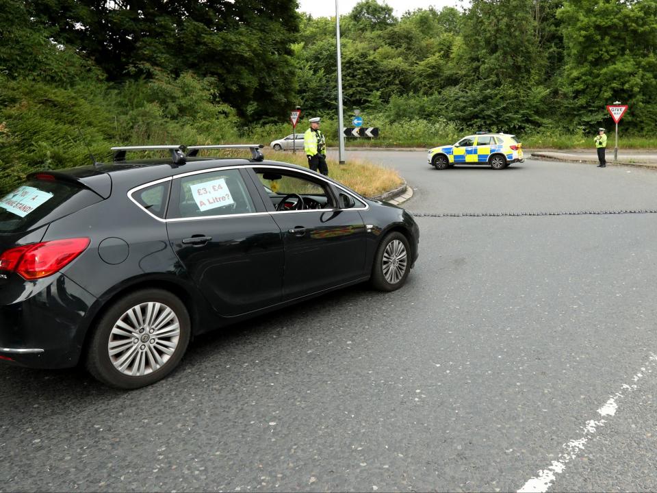 Police put down a stinger at the exit junction to the service station (Getty Images)