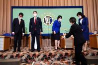 Candidates for the presidential election of the ruling Liberal Democratic Party prepare to pose for photographers prior to a debate session held by Japan National Press Club