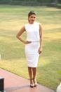 Priyanka Chopra PeeCee makes quite an impact in the all-white ensemble. The high ponytail, bright red lips and the gold stud makes her look radiant.