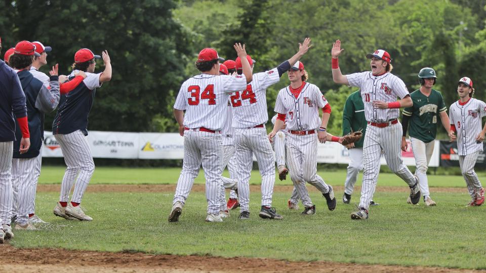 Bridgewater-Raynham's Owen King, No. 11, celebrates with teammates during a game in the Division 1 state tournament against Bishop Feehan on Monday, June 5, 2023.