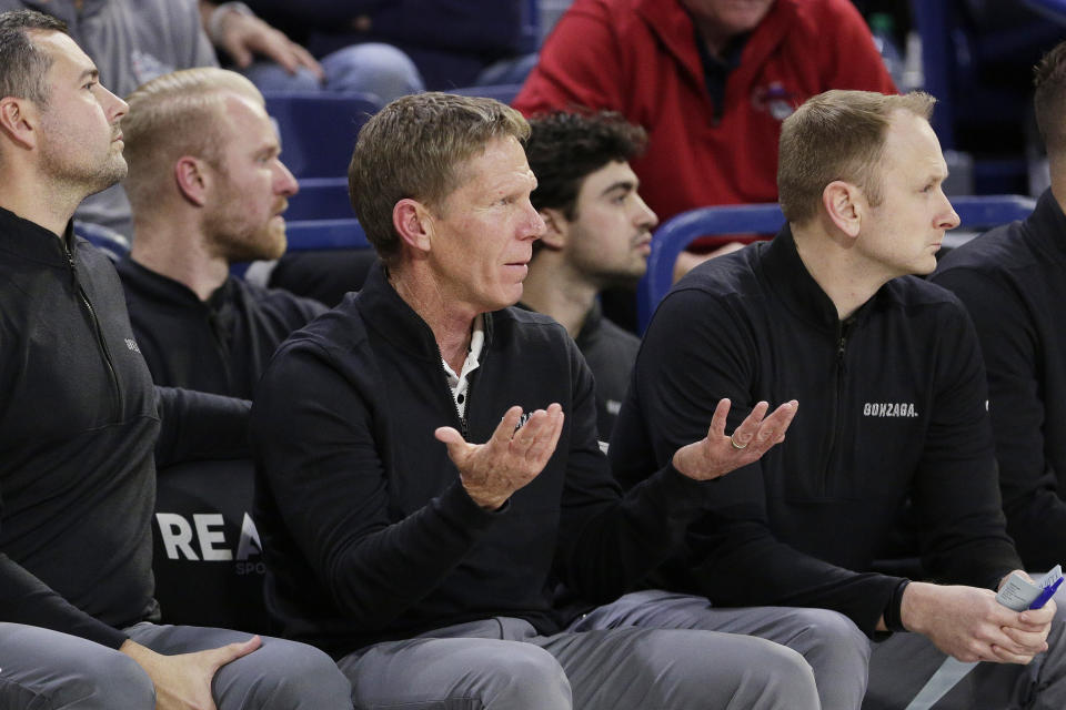 Gonzaga head coach Mark Few, center, reacts during the first half of an NCAA college basketball game against Eastern Oregon, Tuesday, Nov. 14, 2023, in Spokane, Wash. (AP Photo/Young Kwak)