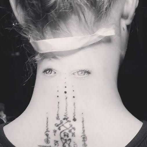 Cara shows off her latest neck tattoo. Photo: Instagram/bangbangnyc