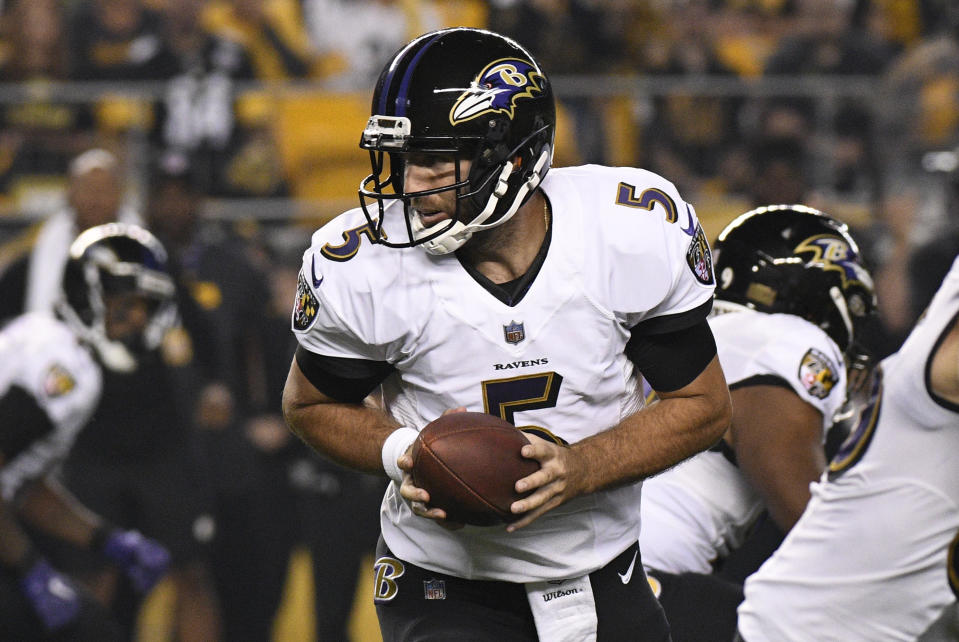 FILE - Baltimore Ravens quarterback Joe Flacco (5) hands off during the first half of an NFL football game against the Pittsburgh Steelers in Pittsburgh, Sunday, Sept. 30, 2018. As Cleveland's quarterback and his new-ish teammates prepare for Saturday's wild-card game in Houston, Flacco's experience — and success — on the road in the postseason is giving the Browns (11-6) an extra boost of confidence. (AP Photo/Don Wright, File)