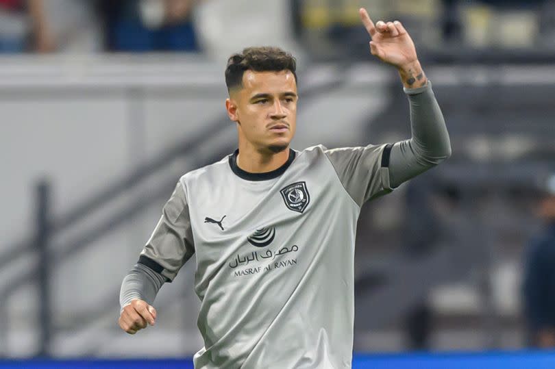 Philippe Coutinho celebrates after scoring for Al-Duhail