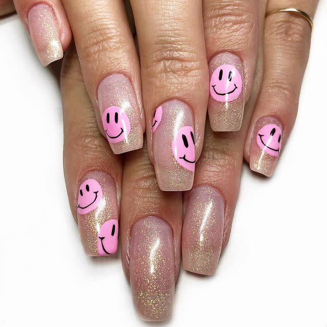 <p>Opt for a sheer pink based glitter and some smiley faces for nails that rival your childhood jelly shoes.</p><p><a href="https://www.instagram.com/p/BrjNOOdg9SX/" rel="nofollow noopener" target="_blank" data-ylk="slk:See the original post on Instagram;elm:context_link;itc:0;sec:content-canvas" class="link ">See the original post on Instagram</a></p>