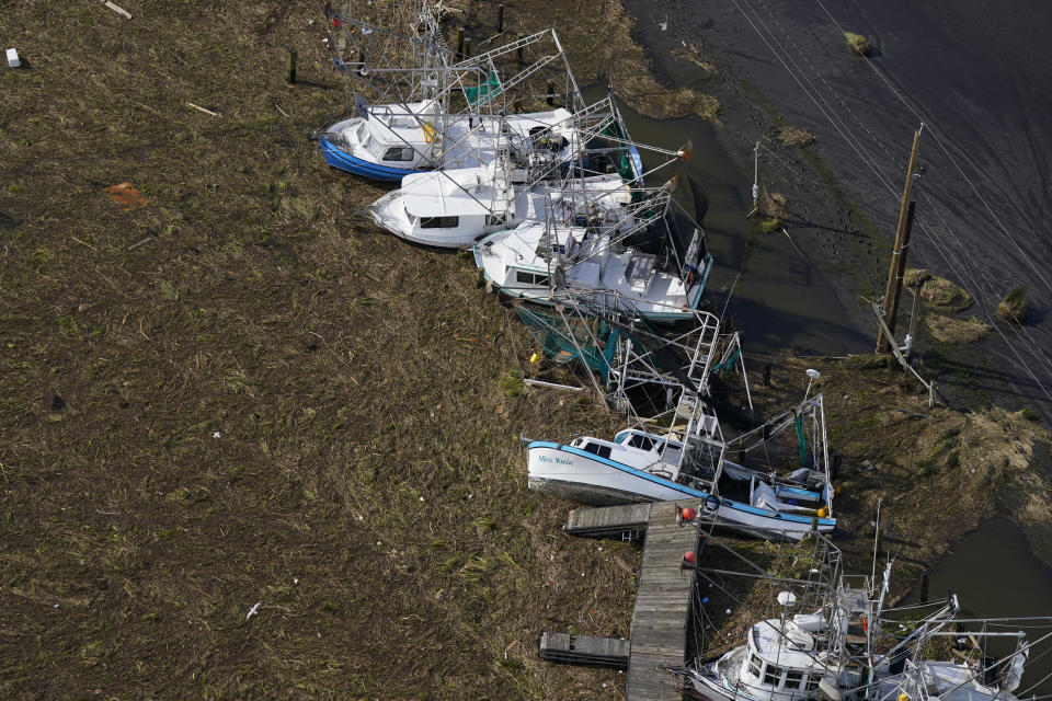 Boats are seen lying on the earth in the aftermath of Hurricane Ida, Monday, Aug. 30, 2021, in Lafitte, La.  The weather died down shortly before dawn. (David J. Phillip/AP Photo) 