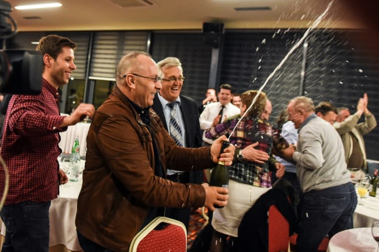 Officials of the Football Federation of Kosovo celebrate in Pristina after the FIFA Congress granted membership to Kosovo's Football Federation
