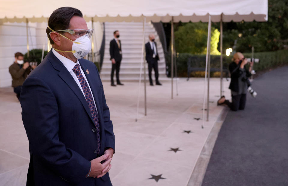 U.S. Service members wear masks and eye protection before President Trump's return to the White House from Walter Reed National Military Medical Center on Oct. 05<span class="copyright">Win McNamee—Getty Images</span>