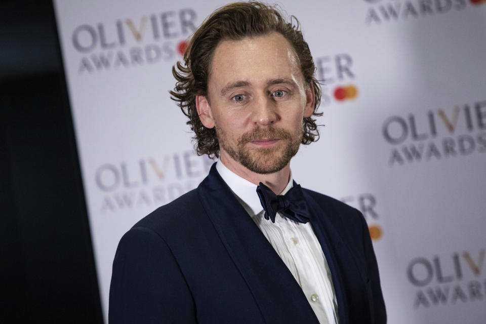 Actor Tom Hiddleston poses for photographers backstage at the Olivier Awards in London, Sunday, April 7, 2019. (Photo by Vianney Le Caer/Invision/AP)