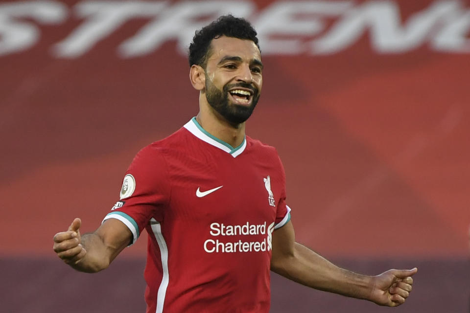 Liverpool's Mohamed Salah celebrates after he scored his side's fourth goal during the English Premier League soccer match between Liverpool and Leeds United, at the Anfield stadium, in Liverpool, Saturday, Sept. 12, 2020. (Shaun Botterill, Pool via AP)