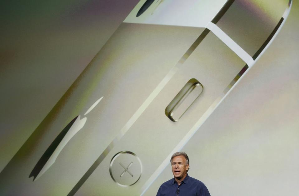 Phil Schiller, senior vice president of worldwide marketing for Apple Inc, talks about the new iPhone 5S at Apple Inc's media event in Cupertino, California September 10, 2013. REUTERS/Stephen Lam (UNITED STATES - Tags: BUSINESS SCIENCE TECHNOLOGY BUSINESS TELECOMS)
