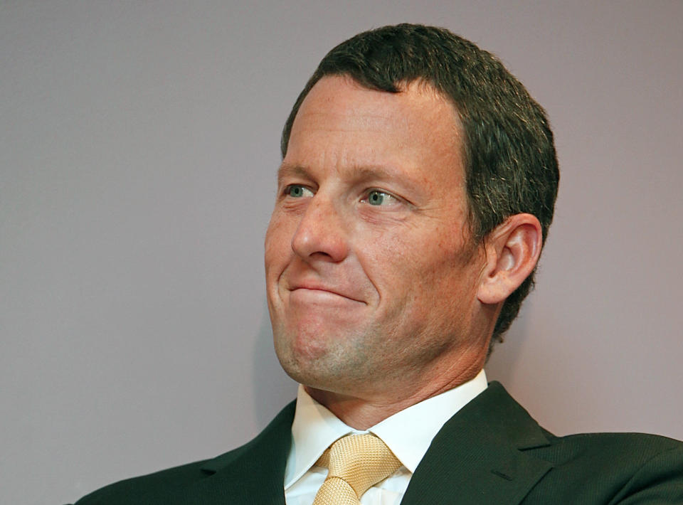 FILE - In this Feb. 28, 2011, file photo, former cycling champion Lance Armstrong smiles during a news conference at the Cedars-Sinai Hospital in Los Angeles. The U.S. Anti-Doping Agency on Wednesday, July 11, 2012, granted Armstrong an extension of up to 30 days to contest drug charges while the seven-time Tour de France winner challenges the case in federal court. (AP Photo/Damian Dovarganes, File)