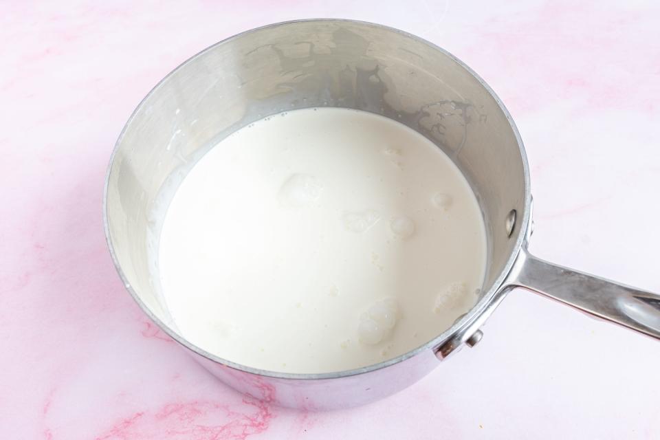 heavy cream in a metal pot