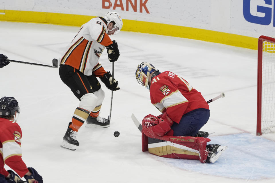 Anaheim Ducks defenseman Cam Fowler (4) attempts a shot on goal as Florida Panthers goaltender Anthony Stolarz (41) defends the net during the first period of an NHL hockey game, Monday, Jan. 15, 2024, in Sunrise, Fla. (AP Photo/Marta Lavandier)