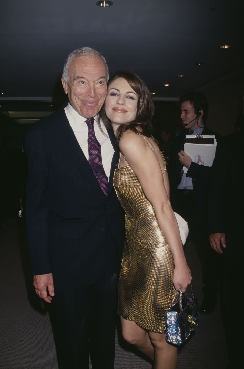 <p>Elizabeth posing with the Chief Executive Officer of Estée Lauder at the time, Leonard Lauder, at an event for the company at Christie's.</p>