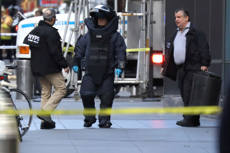 A member of the New York Police Department bomb squad is pictured outside the Time Warner Center in the Manahattan borough of New York City after a suspicious package was found inside the CNN Headquarters in New York, U.S., October 24, 2018. REUTERS/Kevin Coombs