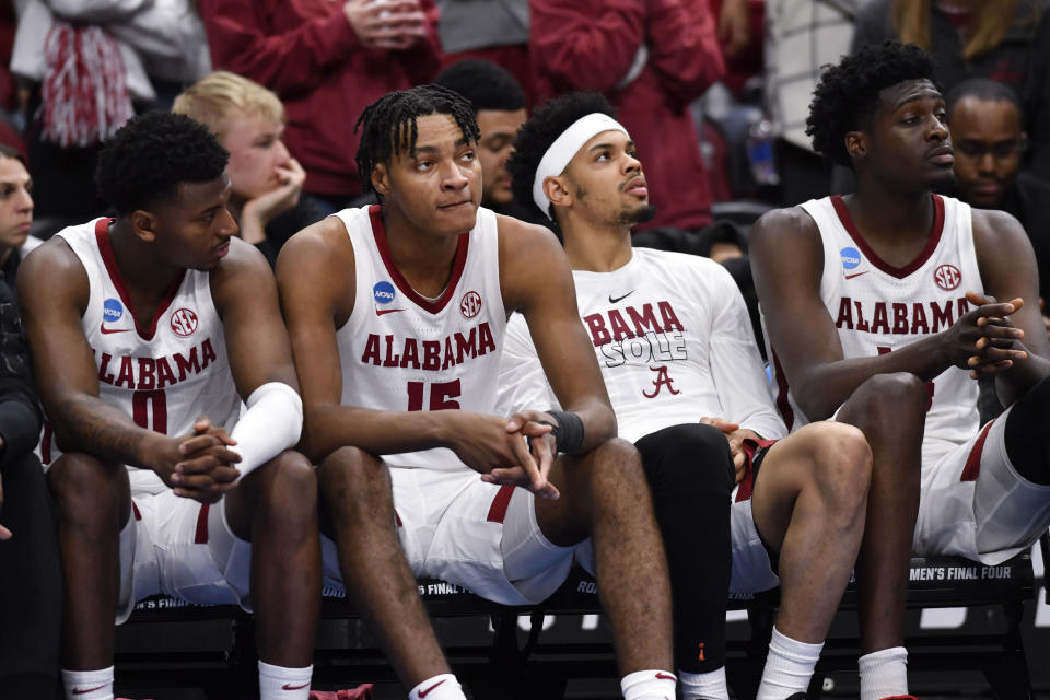 The Alabama team sits on the bench in the closing seconds of the second half of a Sweet 16 round college basketball game against San Diego State in the South Regional of the NCAA Tournament, Friday, March 24, 2023, in Louisville, Ky. San Diego State won 71-64. (AP Photo/Timothy D. Easley)