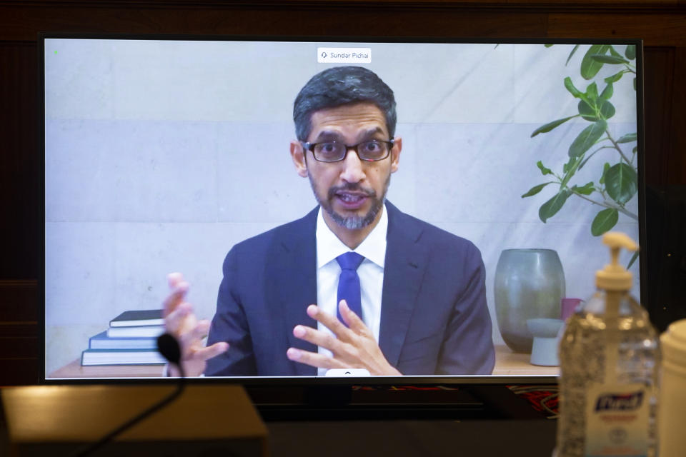 Google CEO Sundar Pichai appears on a screen as he speaks remotely during a hearing before the Senate Commerce Committee on Capitol Hill, Wednesday, Oct. 28, 2020, in Washington. The committee summoned the CEOs of Twitter, Facebook and Google to testify during the hearing. (Michael Reynolds/Pool via AP)