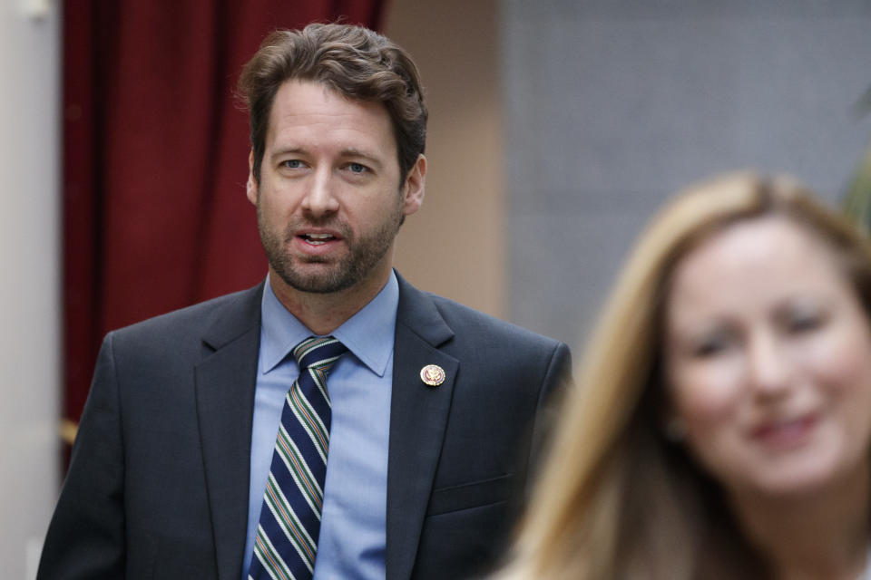 FILE - In this Jan. 4, 2019, file photo, Rep. Joe Cunningham, D-S.C., walks to a closed Democratic Caucus meeting on Capitol Hill in Washington. Virtually all of the Democratic presidential hopefuls have reached out to Cunningham who flipped a House seat in early-voting, conservative South Carolina. Democrats hoping to unseat President Donald Trump in 2020 are dancing with the freshman stars these days in an unprecedented pursuit of still-green lawmakers in an institution driven by seniority. (AP Photo/Carolyn Kaster, File)