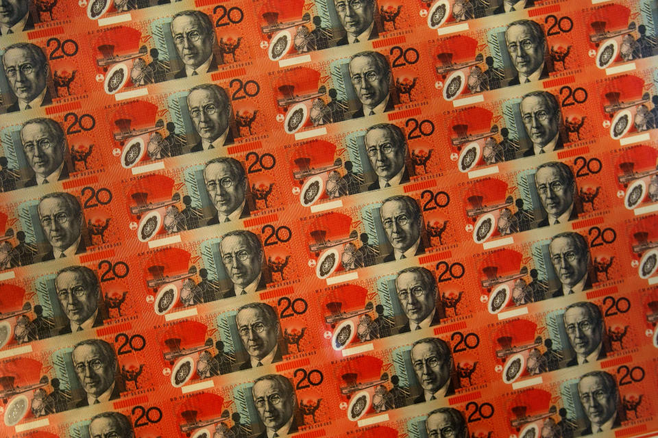 A sheet of uncut Australian twenty dollar notes are displayed at the Reserve Bank of Australia in Sydney, October 28, 2008. The Australian dollar extended gains on Wednesday, pulling away from recent multi-year lows, lifted by higher stock markets which helped revive appetite for higher-yielding currencies.    REUTERS/Tim Wimborne  (AUSTRALIA)