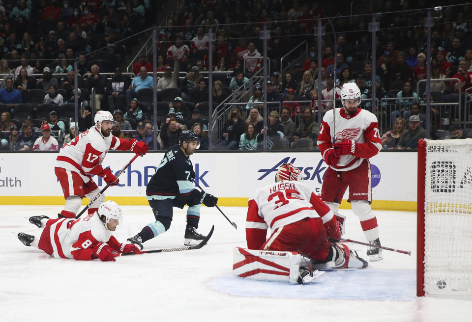 Seattle Kraken right wing Jordan Eberle (7) scores as Detroit Red Wings goaltender Ville Husso (35) looks for the puck during the second period of an NHL hockey game Saturday, Feb. 18, 2023, in Seattle. (AP Photo/ Lindsey Wasson)