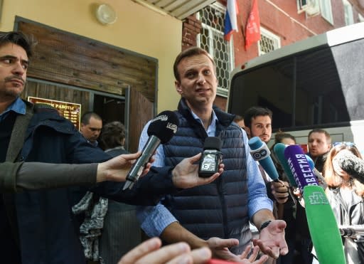 Russian opposition leader Alexei Navalny, who was detained during a May 5 anti-Putin rally, speaks to the media outside a court building in Moscow where he was sentenced to 30 days behind bars