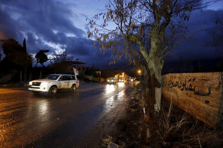 A Red Crescent aid convoy enters Madaya, Syria, January 14, 2016. REUTERS/Omar Sanadiki