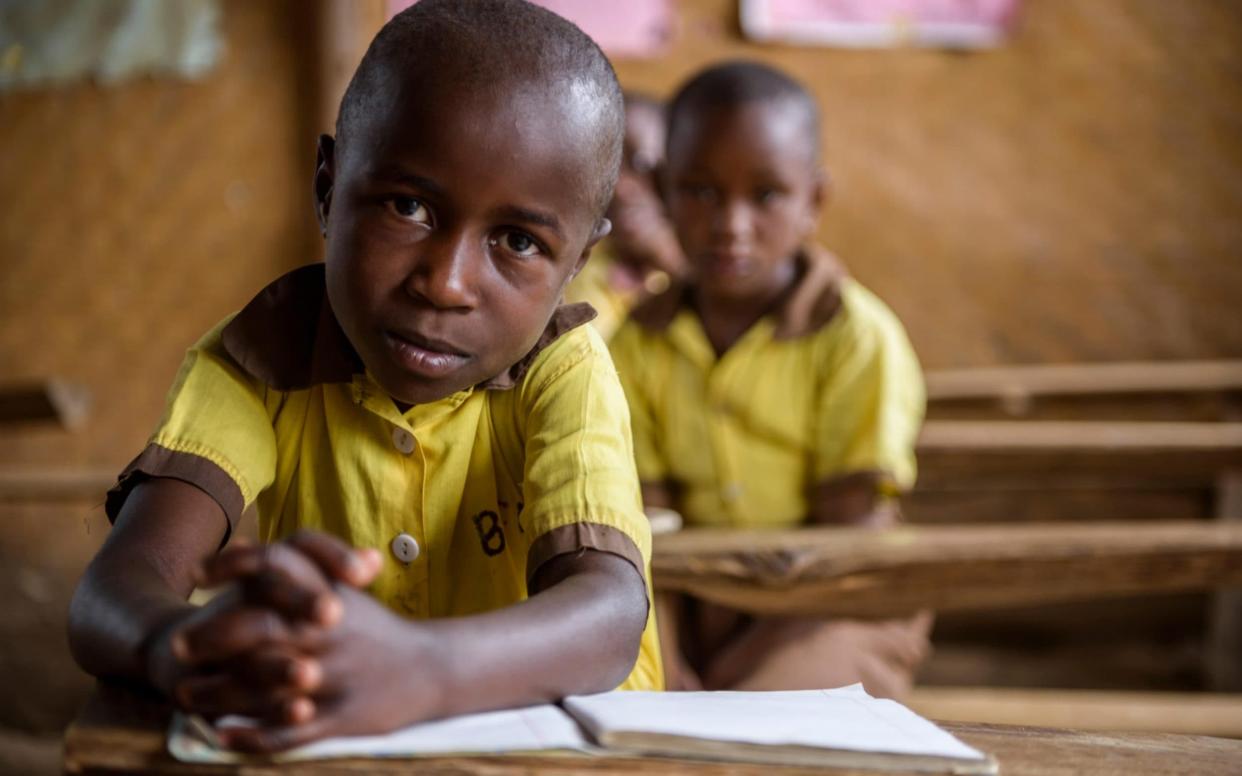 Stock image of some children in a classroom in Uganda - Alamy Stock Photo