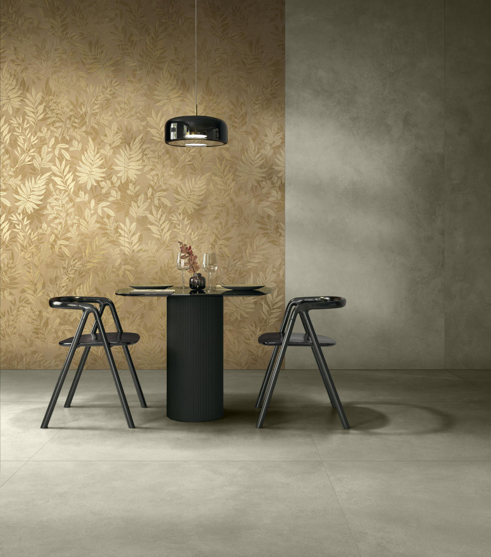 Milan Design Week Marazzi Golden Leaf Incanto wall slab in gold leaf in dining space