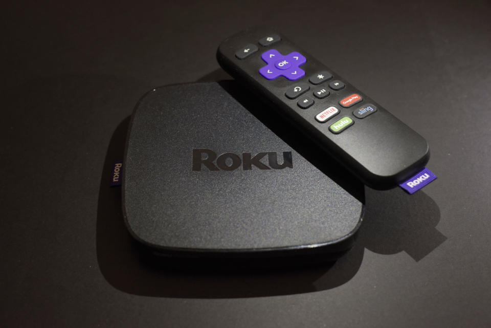 FILE - This Nov. 16, 2016 file photo shows the Roku Premiere streaming TV device in New York.  Roku plans to add a voice-controlled digital assistant to expanding lineup of online video players in an attempt to catch up with Google, Apple and Amazon. The internet-connected assistant will focus exclusively on fielding spoken request about video, music and other tasks tied to entertainment.  (AP Photo/Patrick Sison, File)