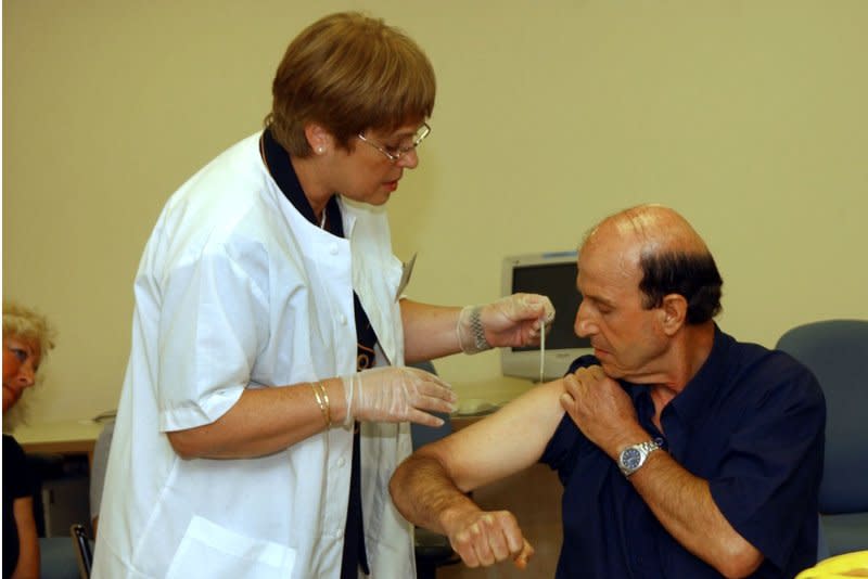 Ruti Zach, of the Israeli Health Ministry, inoculates an unidentified health worker with the smallpox vaccination at Tel HaShomer Hospital in Tel Aviv, on September 2, 2002. On May 14, 1796, Dr. Edward Jenner, a rural England physician, tested his smallpox vaccine. It was a success. File Photo by Debbie Hill UPI