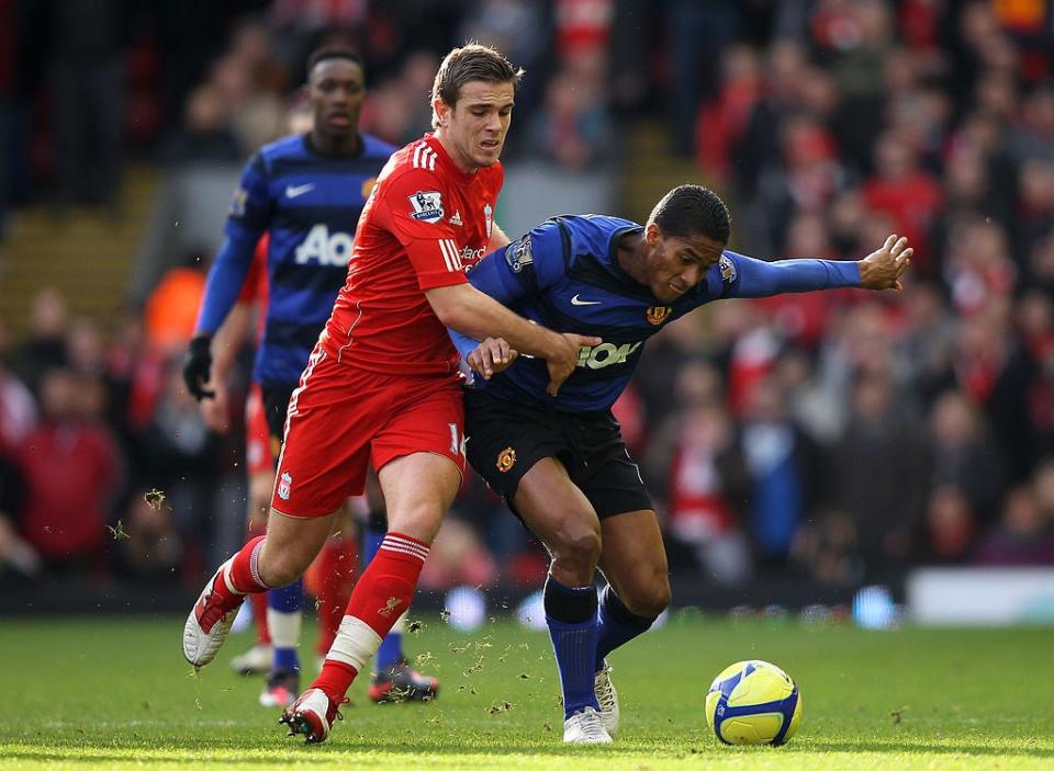 Jordan Henderson competes with Antonio ValenciaGetty