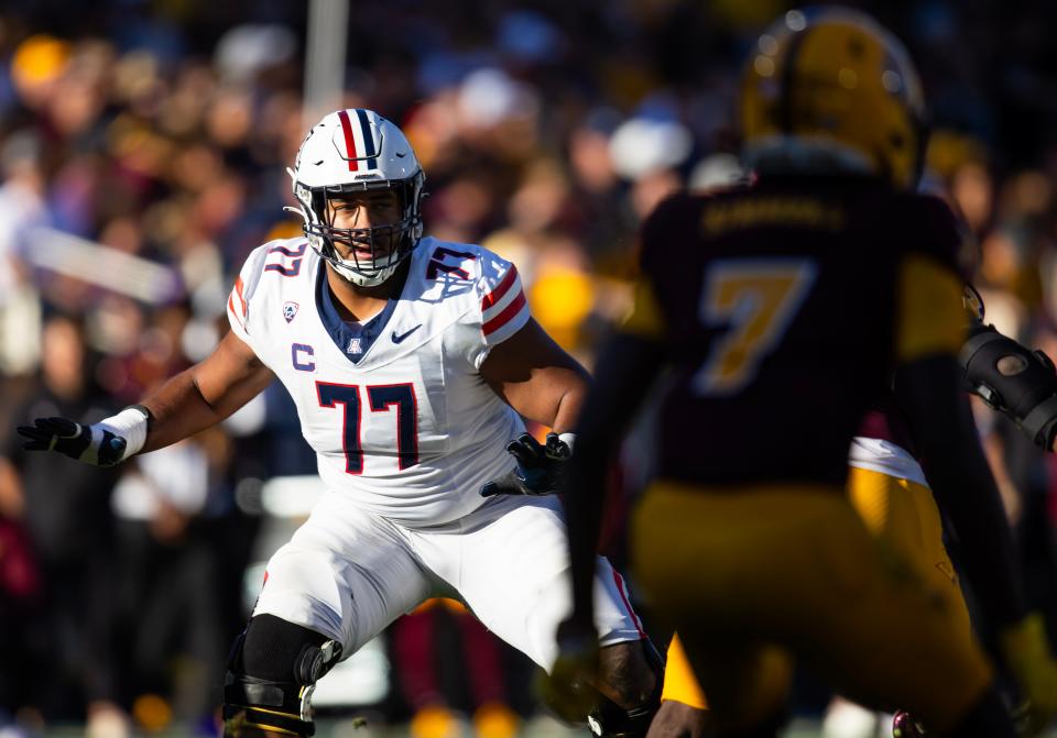 Arizona Wildcats offensive lineman Jordan Morgan (77) against the Arizona State Sun Devils during the Territorial Cup at Mountain America Stadium in Tempe on Nov. 25, 2023.